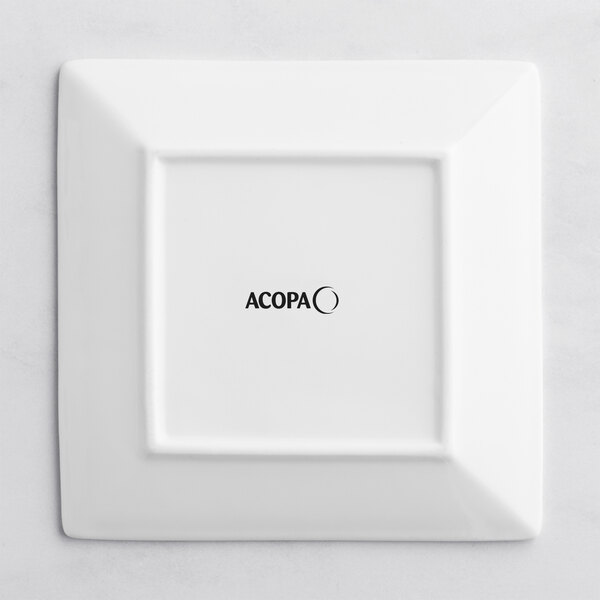 A bright white square Acopa porcelain plate with black text reading "Acopa"