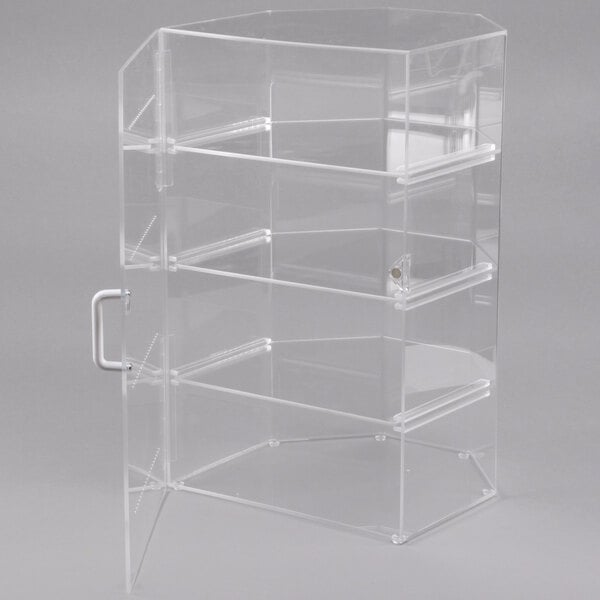 A clear acrylic Cal-Mil cake and pie display case with four compartments and white handles.