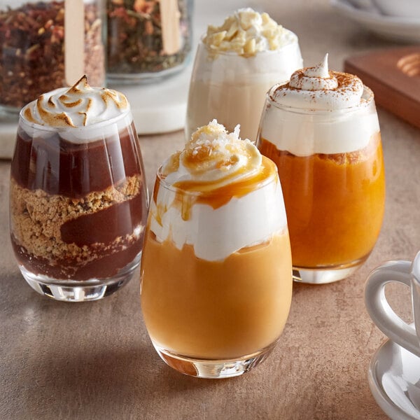 Acopa Stemless Wine Tasting Glasses filled with drinks on a table.