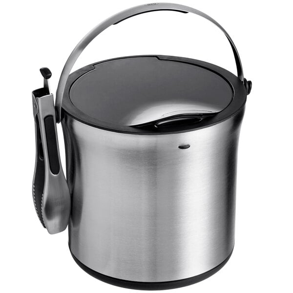 An OXO stainless steel ice bucket with tongs.