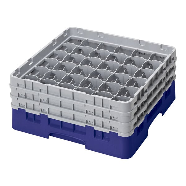 A navy blue plastic Cambro glass rack with 36 compartments.