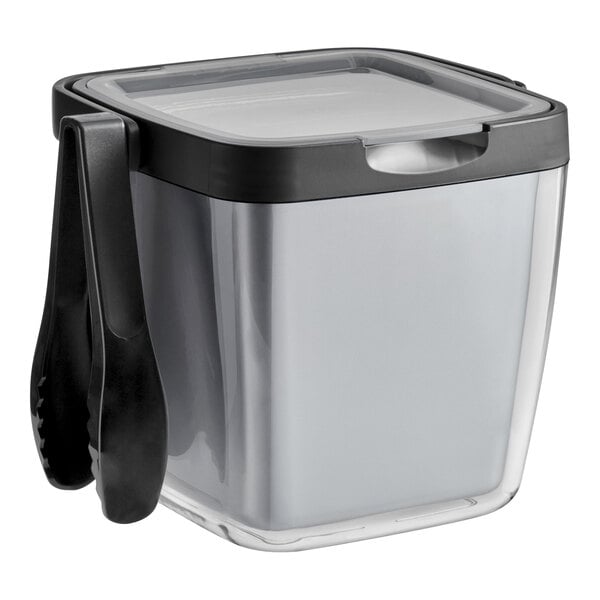 An OXO clear plastic insulated ice bucket with a black lid and tongs inside.