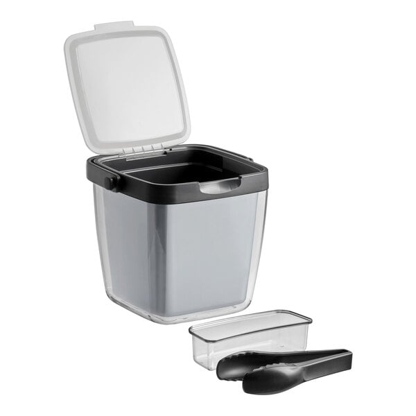 An OXO plastic ice bucket set with tongs and garnish tray.