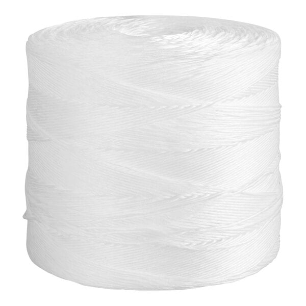A large spool of white twine with tightly wound strands.