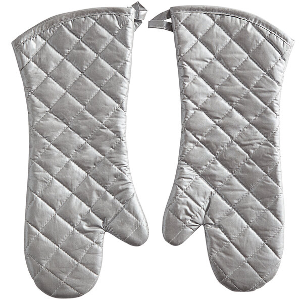 A pair of silver silicone-coated oven mitts with a quilted design.