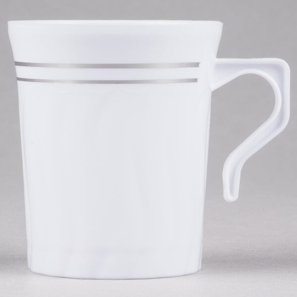 a white mug with silver stripes