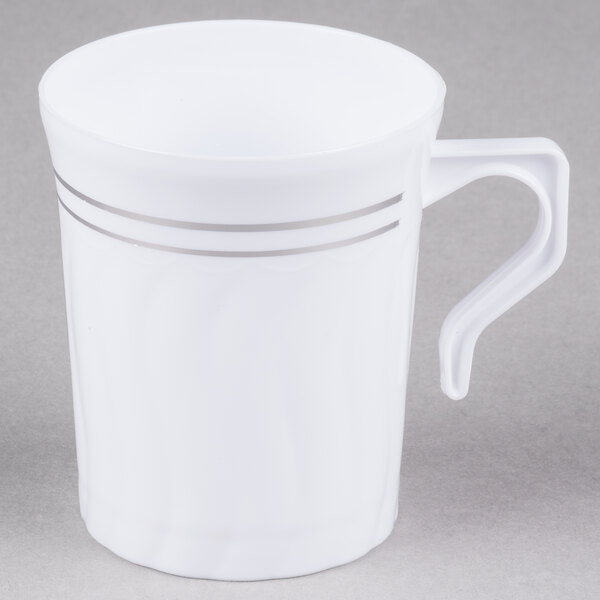 A white Fineline plastic coffee mug with silver stripes.