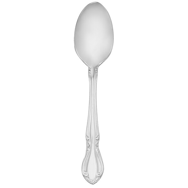 A silver Walco Illustra demitasse spoon with a handle.