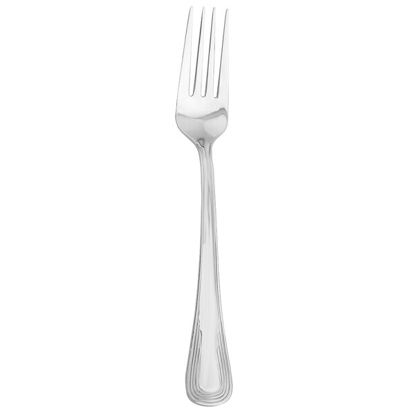 A silver Walco stainless steel dinner fork with a white background.