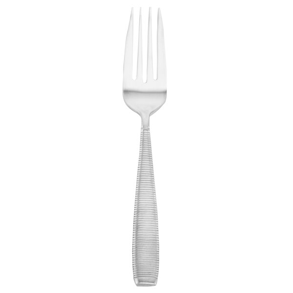 A Walco stainless steel dinner fork with a silver handle.