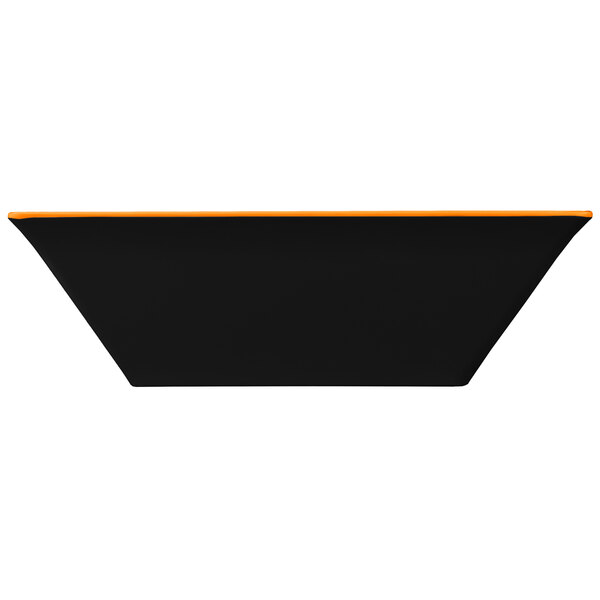 A black rectangular melamine bowl with an orange border.