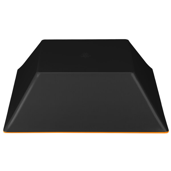 A black rectangular GET Brasilia melamine bowl with an orange square top.