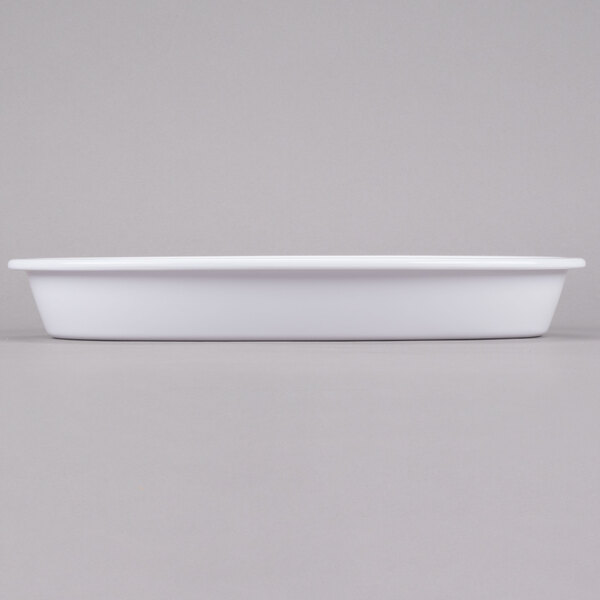 A white rectangular container on a gray surface.