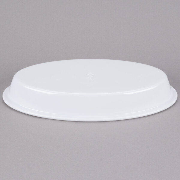 A white oval melamine casserole dish with a white plastic lid.