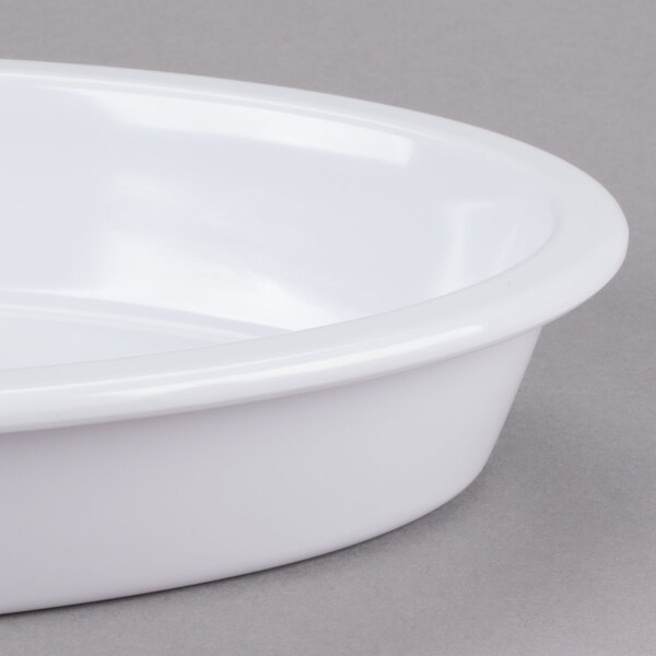A white oval GET Melamine casserole dish.