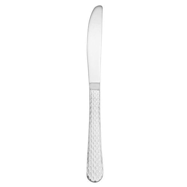 A Walco stainless steel table knife with a silver handle on a white background.