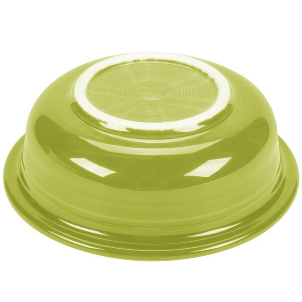 A green bowl with a white rim.