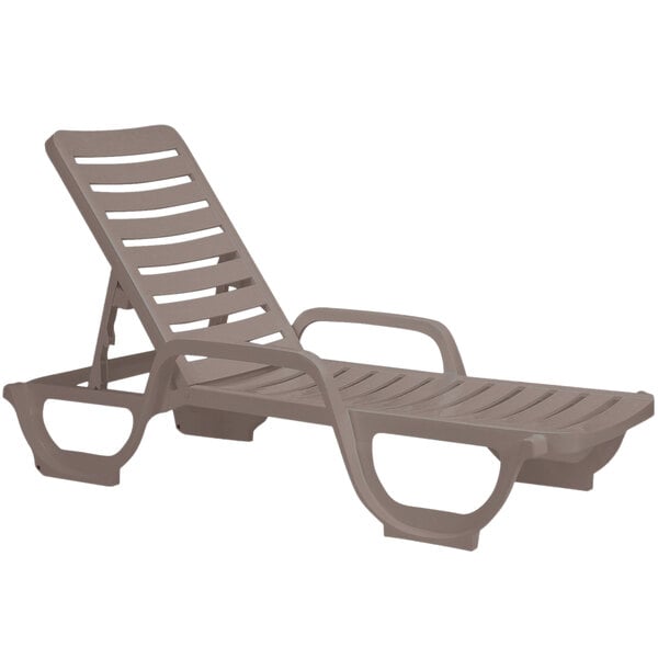 A Grosfillex taupe resin chaise lounge chair with armrests.