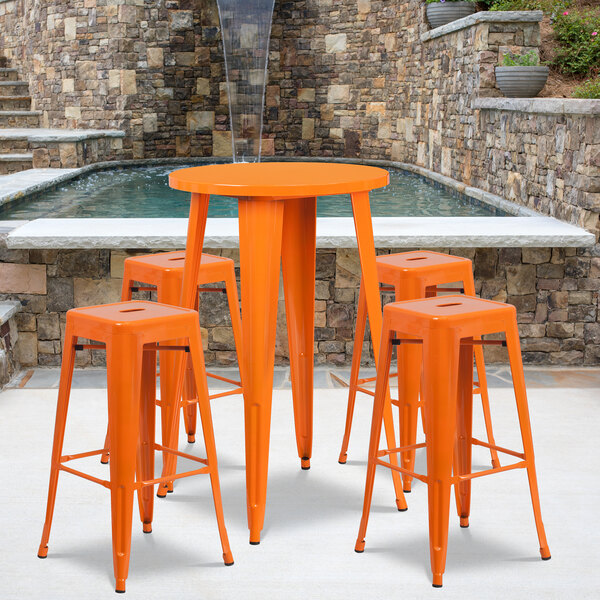 An orange Flash Furniture bar height table with 4 square stools.