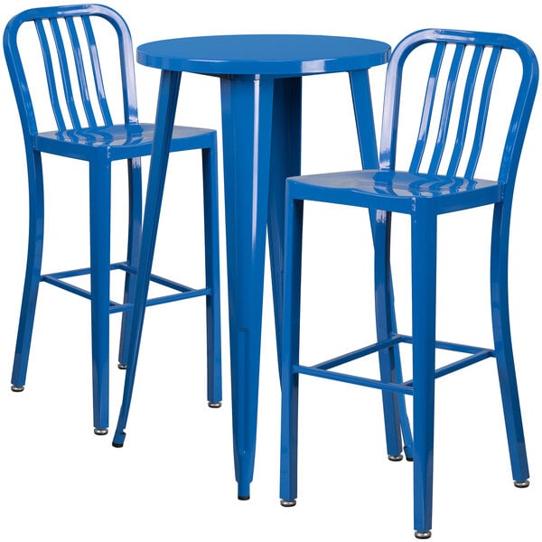 A blue metal round bar height table with two blue metal stools with vertical slat backs.