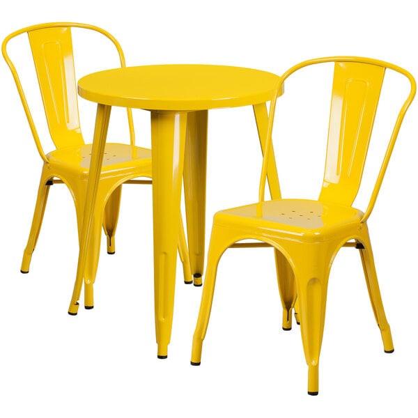 A yellow metal table with two yellow chairs.