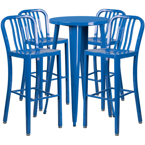 A blue metal round bar table with four blue stools with vertical slat backs.