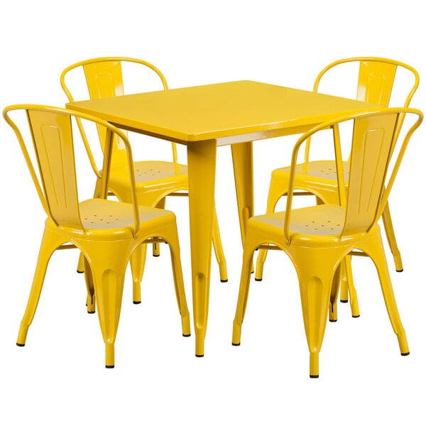 A yellow metal table with four yellow chairs.