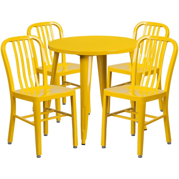 A yellow metal table with yellow chairs.