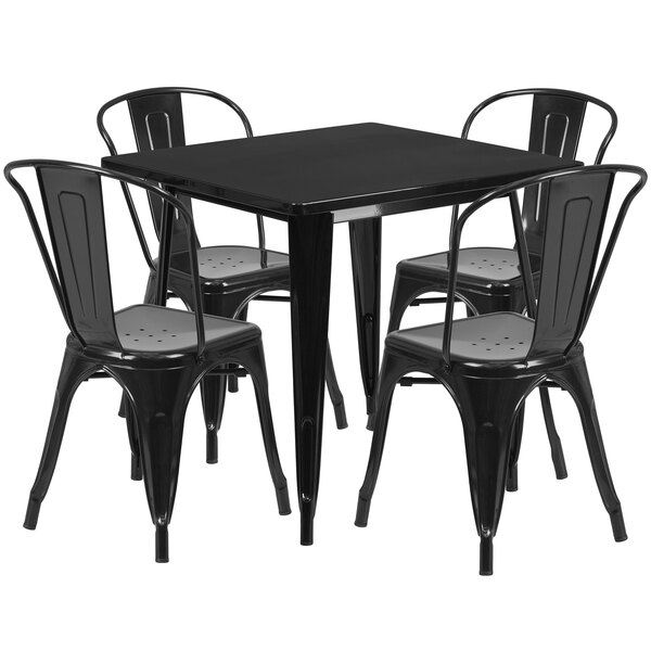 A black square metal table with four black chairs.