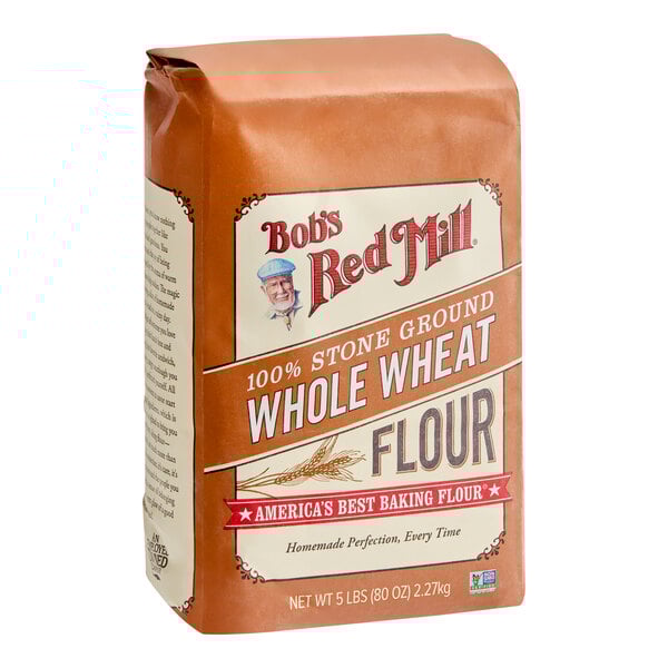 A 5-pound bag of Bob's Red Mill 100% stone ground whole wheat flour.