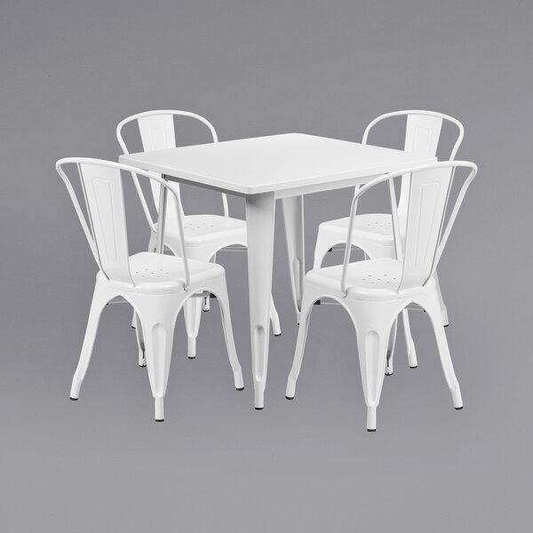 A Flash Furniture white metal table and chairs set.