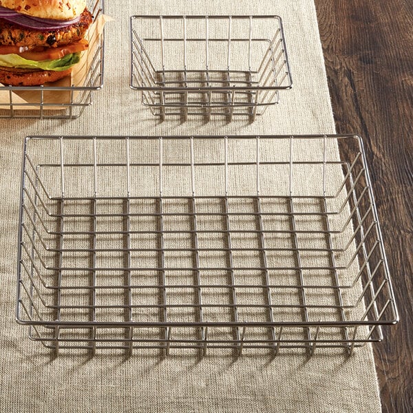 An American Metalcraft stainless steel square wire basket with a sandwich in it.