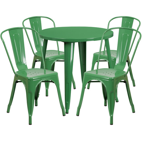 A green metal table with four green metal chairs.