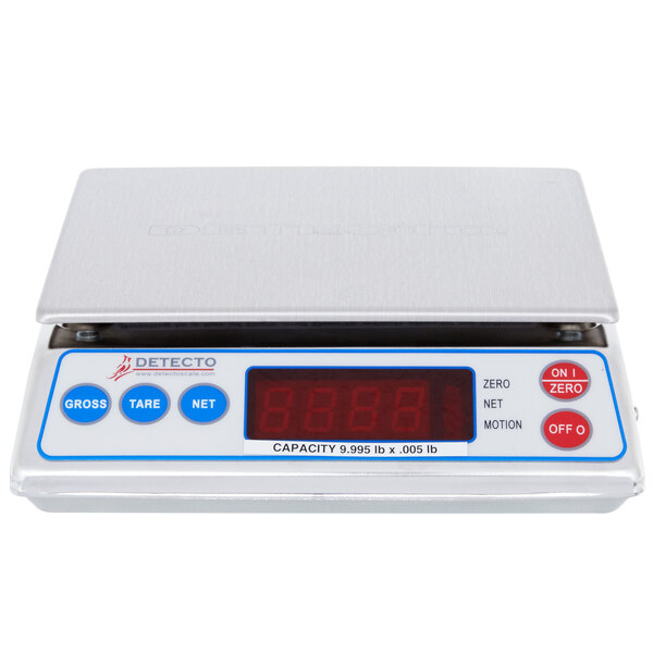 A white Cardinal Detecto digital portion scale on a counter.