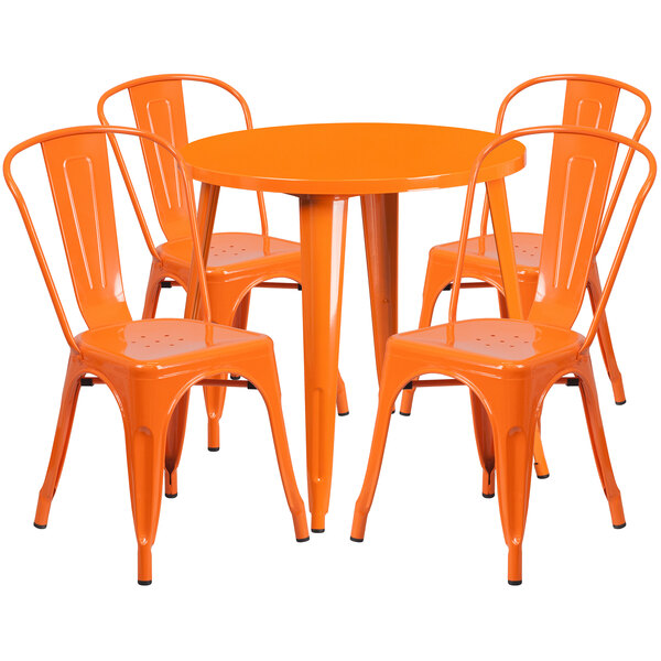 An orange metal table with four matching chairs.