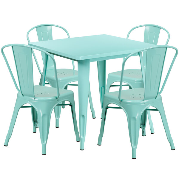 A Flash Furniture square metal table in mint green with four matching chairs on an outdoor patio.