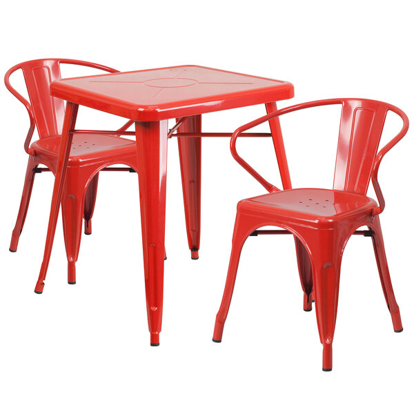 A red metal table and chairs set.