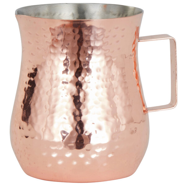 An American Metalcraft copper bell creamer with a handle.