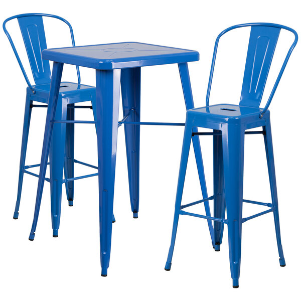 A blue metal bar table with a blue and white top and two blue metal stools.