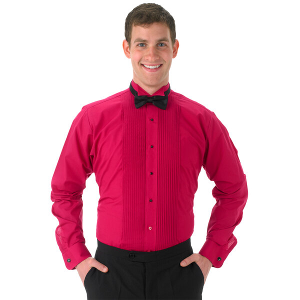 A man wearing a Henry Segal fuchsia tuxedo shirt with a wing tip collar and bow tie.