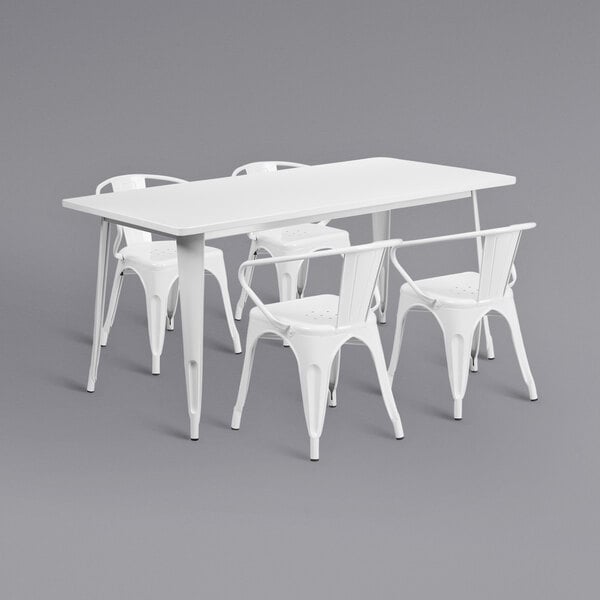 A white rectangular metal table with four white metal arm chairs.