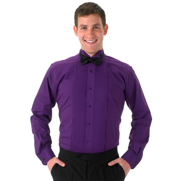 A man wearing a Henry Segal purple tuxedo shirt with a wing tip collar and a black bow tie.