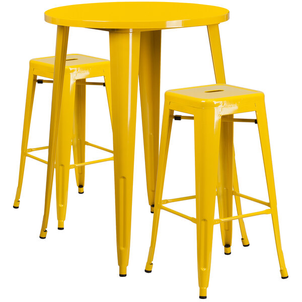 A Flash Furniture yellow metal bar table with 2 yellow square seat backless stools.