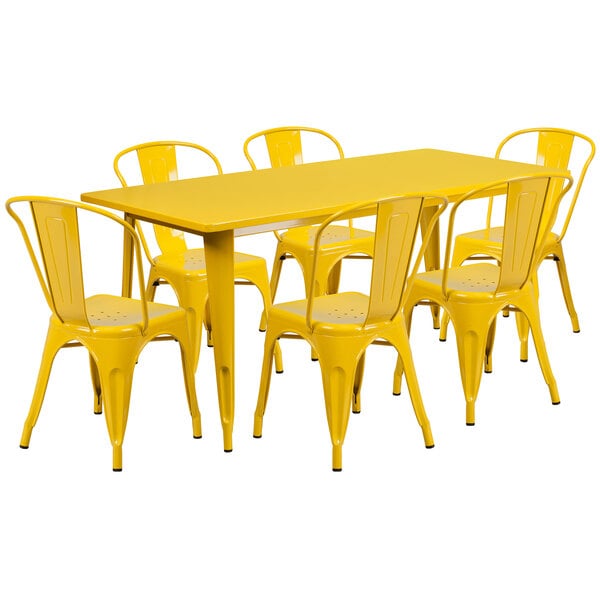 A yellow rectangular table with yellow chairs.