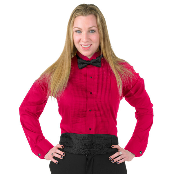 A woman in a red Henry Segal tuxedo shirt with a black bow tie.