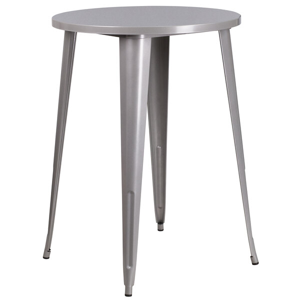 A Flash Furniture silver metal bar height table with a round top and legs.