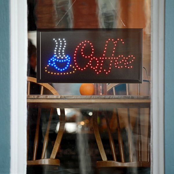 A rectangular LED sign that says "Coffee" in white lights.