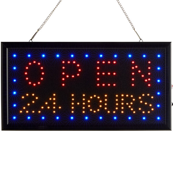 A rectangular white LED sign that says "Open 24 Hours" with red lights on it.