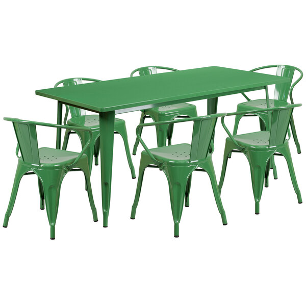 A green metal table with six chairs, one with arms.