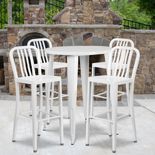 A white Flash Furniture bar table and four chairs set.